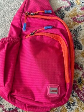 Lexxi Bright Pink Sling Backpack with Orange Trim